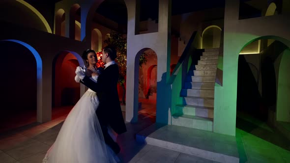 A Beautiful Couple is Dancing in the Castle They are Enjoying Each Other and Smiling alt