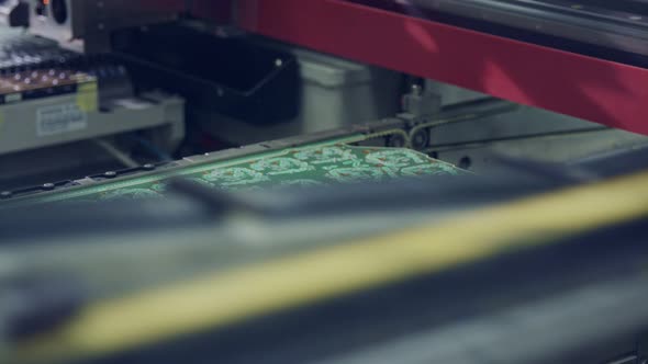 Surface Mount Technology SMT Machine places components on a circuit board alt