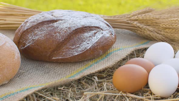 Bread and Chicken Eggs on Fresh Hay alt