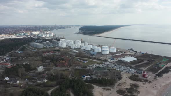 AERIAL: Port of Klaipeda with Loading Terminal and Docking Harbors with City in Background