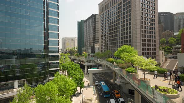 Seoullo 7017 skygarden park over Seoul downtown skyscrapers and traffic under the bridge  - elevated alt
