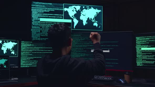 Asian Boy Hacker Using Multiple Computer Hacking And Success Downloading Data alt