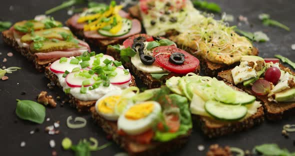 Top View of Different Decorated Sandwiches As Appetizer alt