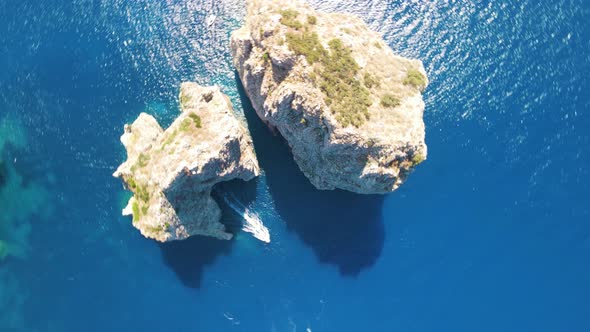 Amazing Aerial View of Faraglioni Rocks Over the Sea in Capri Island Italy alt