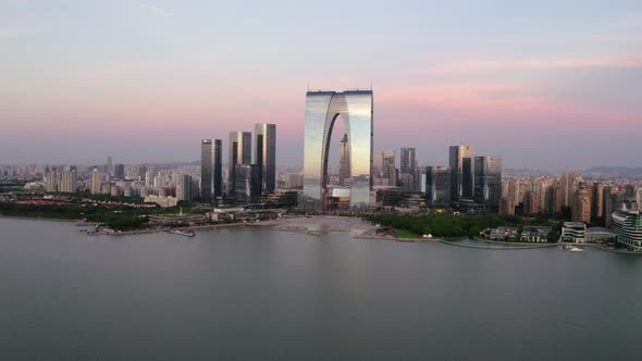 CBD buildings by the lake. Aerial in Suzhou, China alt
