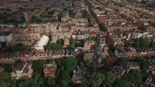 Aerial Shot of Amsterdam with Houses and Volden Church alt