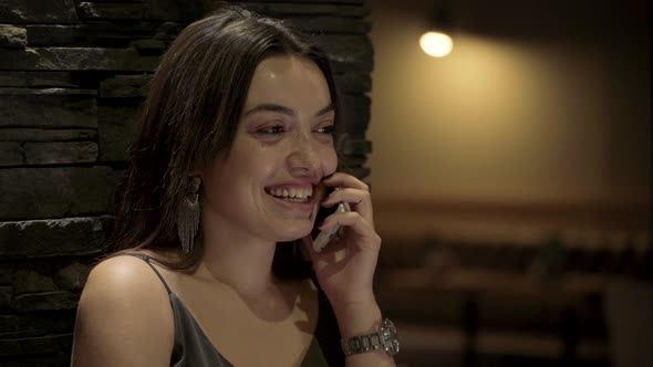 Happy Woman Talking Smartphone alt