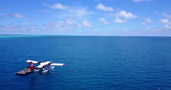 Daytime drone clean view of a summer white paradise sand beach and blue sea background alt
