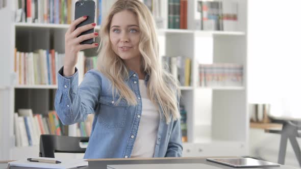 Young Woman Taking Selfie with Smartphone Photograph alt
