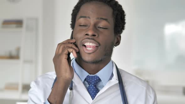African Doctor Talking on Phone alt