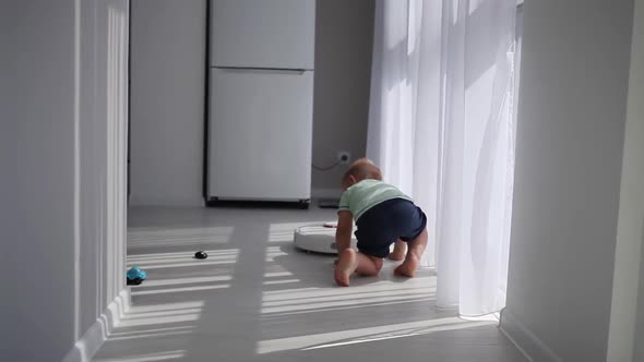 A smart robot cleans a vacuum cleaner on the floor and runs into a child.