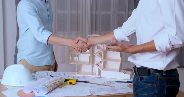 Architect And The Engineering Contractor Shaking Hands On Building Engineering Contractor Shaking Hands
