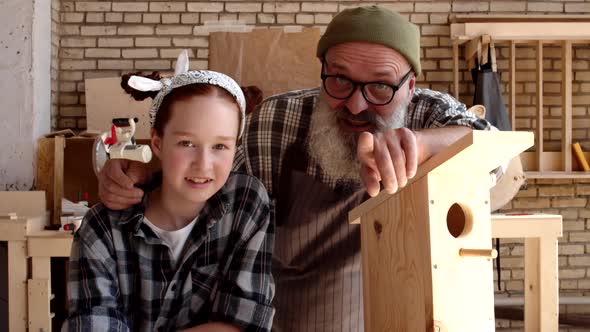 Caucasian Girl and Senior Man in Joinery alt