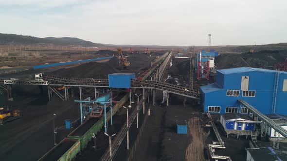 General View of the Coal Mine Loading Station with Moving Freight Train