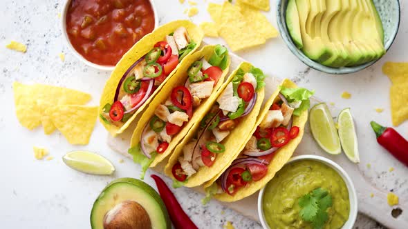 Tasty Mexican Meat Tacos Served with Various Vegetables and Salsa alt