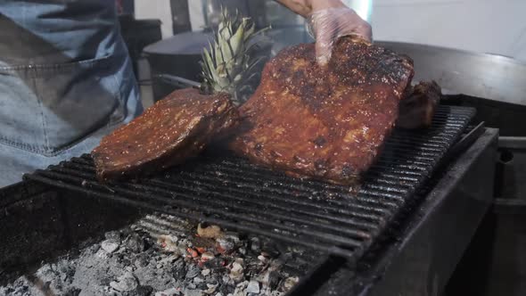 Meat Is Grilled at Street Food Festival. Large Pieces of Pork Roasted on the BBQ alt