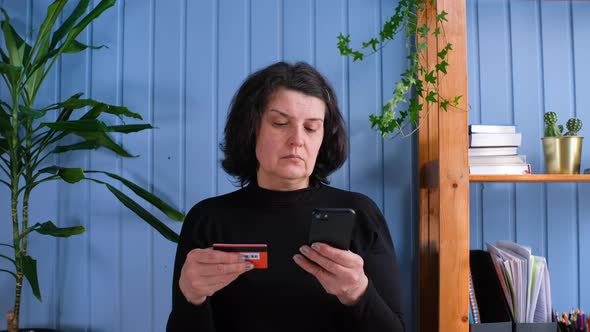 Adult Woman Using Credit Card for Online Shopping