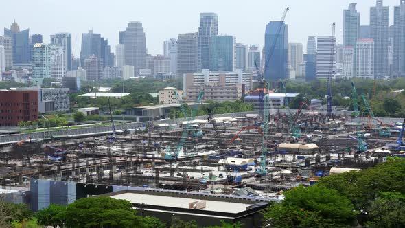 Panoramic View of Cityscape and Construction Site in Metropolis alt