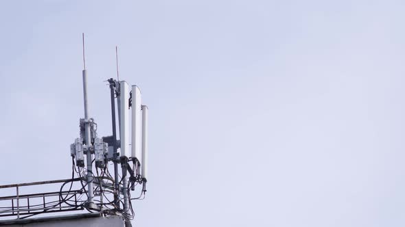 Mobile Phone Communication Tower on Building Roof