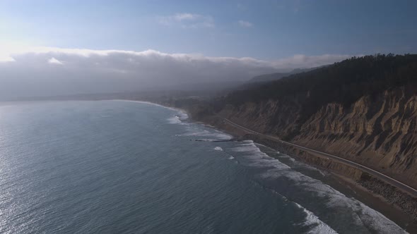 Aerial Drone Shot of a Road Lining a Scenic Coastline (Pacific Coast Highway, California)