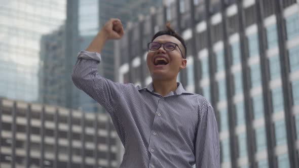 Portrait handsome Asian businessman after a working have success.