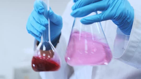 Medical Research Scientist Prepares Solutions in Applied Science Laboratory alt