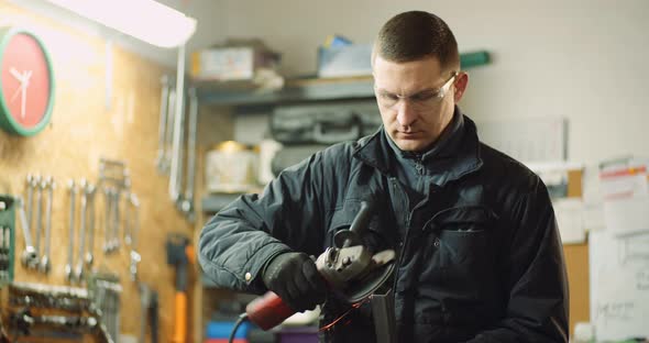 Angle Grinder Cutting Metal at Workshop alt