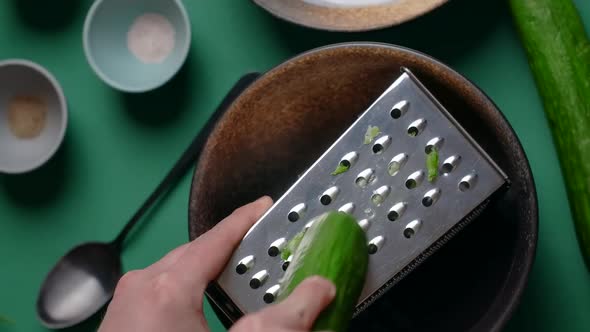 Vertical Flat Lay Video Recipes Chef Grates Cucumber on the Grater