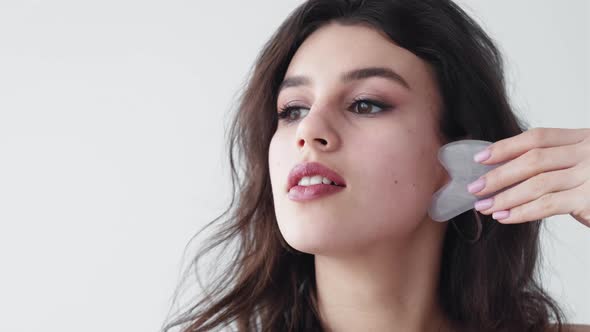 Gua Sha Facial Massage Woman with Face Quartz Tool alt