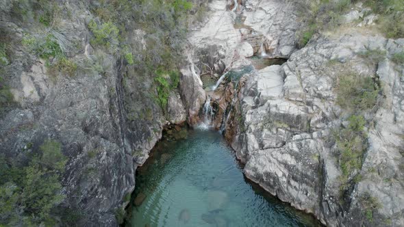 Aerial ascending view over waterfall Portela Do Homem. National Park Peneda-Gerês, Portugal