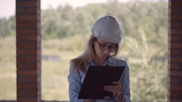 Designer On Construction Site. Builder Contractor Specialist Read Plan Scheme. Civil Engineer. alt