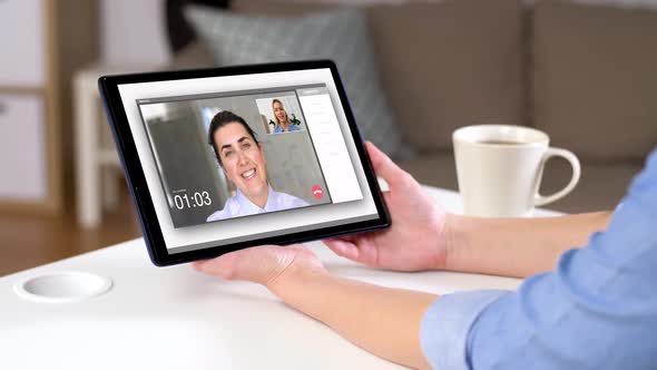 Woman Having Video Call on Tablet Computer at Home 127 alt