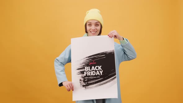 Black Friday Video Footage - A Woman Holding A Black Friday Sale Posters alt