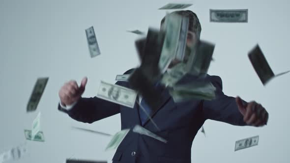 Dollars Falling on Dancing Businessman alt