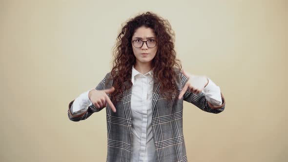 Hey Subscribe Here the Resentful Young Woman Looks with Both Fingers Down Like a Gesture alt