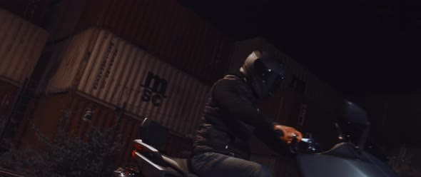 Motorbike driver at night alt