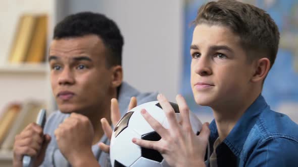 Two Teenage Boys Upset With Favorite Team Losing Sports Championship Match alt