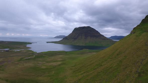 The famous Kirkjufell mountain in Iceland seen from the air alt