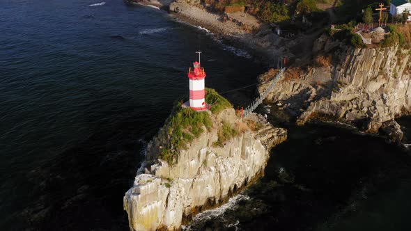Drone View of the Picturesque Old Basargin Lighthouse on the Coast of the Sea alt