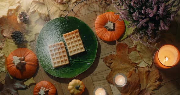 Tabletop Video of the Waffles is Being Sprinkled with Powdered Sugar in Slow Motion Decorated Autumn alt