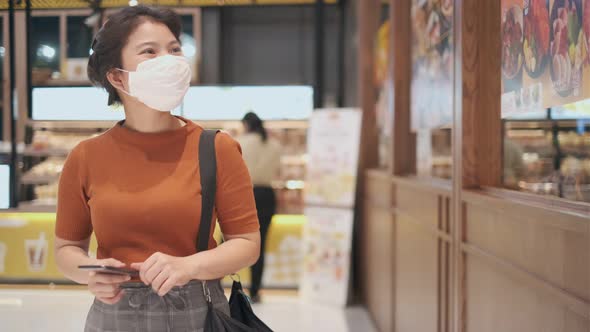 asian female looking for home appliances renovation product New normal lifestyle alt