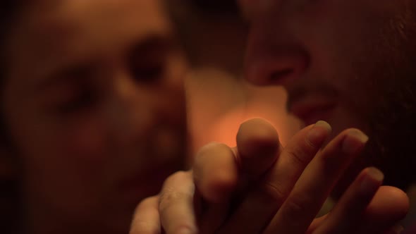 Closeup Couple Fingers Touch Each Other Fireplace alt