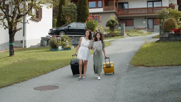 Tourists with Suitcases Using Paper Map alt