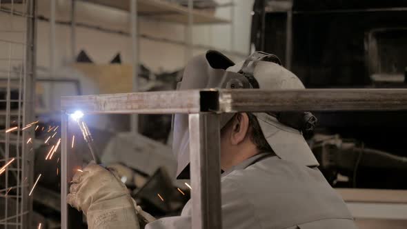  Welding Process. A Welder In Helmet Doing His Job