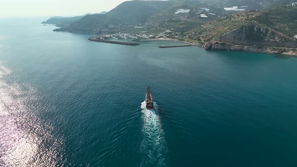 The Pirates yacht calls at the port aerial view 4 K alt