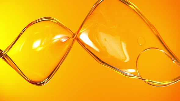 Super Slow Motion Shot of Swirling and Splashing Golden Oil at 1000Fps alt