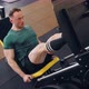 A Young Pumped Up Athlete Does Another Leg Exercise In The Gym In Preparation For Competition. - VideoHive Item for Sale