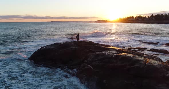 Couple enjoying the sunset in Curtis island lighthouse Camden Maine USA alt
