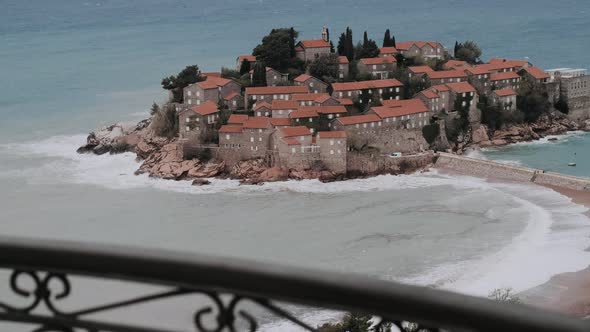View on the Island of Sveti Stefan on a cloudy day. Montenegro, the Adriatic Sea, the Balkans. alt