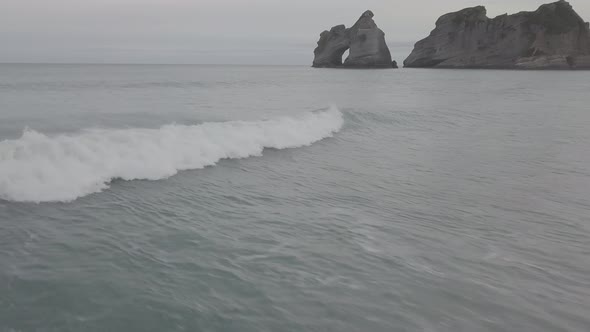 Flying with waves on beautiful beach alt